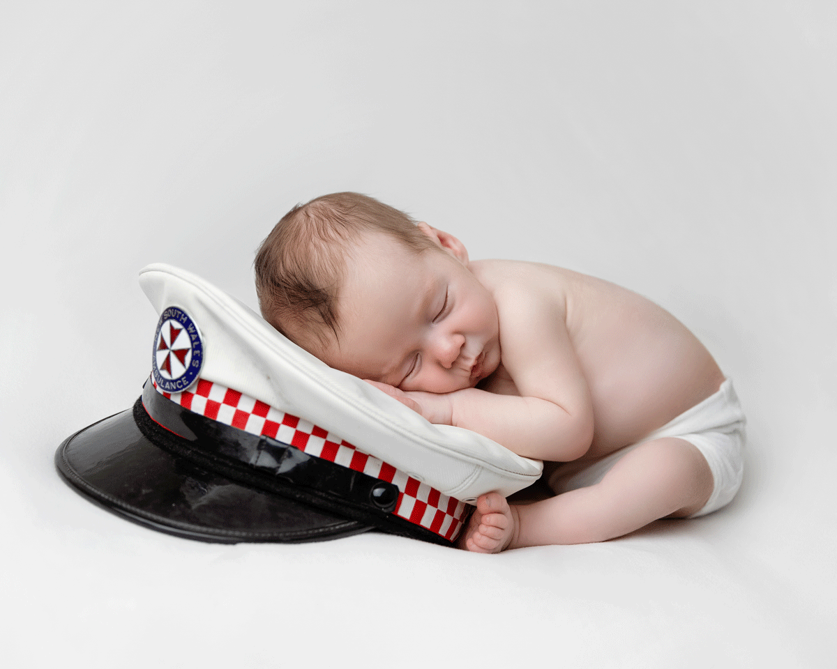 cute baby on paramedic hat
