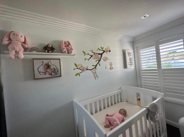 baby room with crib and toys