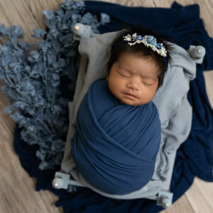 newborn girl in soft blues