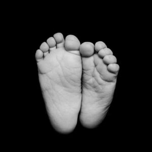 Black and white newborn feet