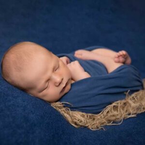 Baby in Blue wrap and hessian
