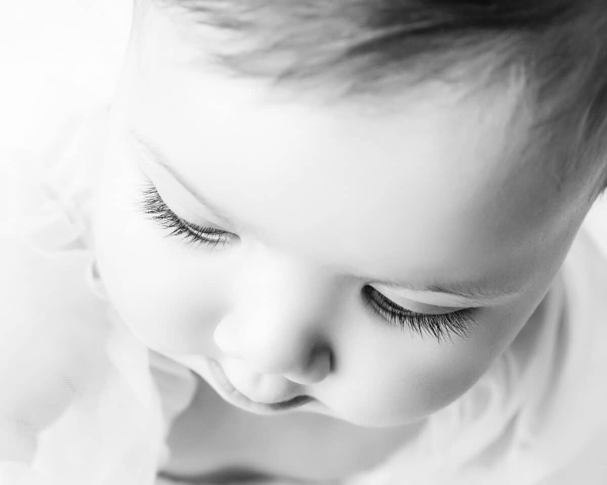 black and white baby photo with eyelashes